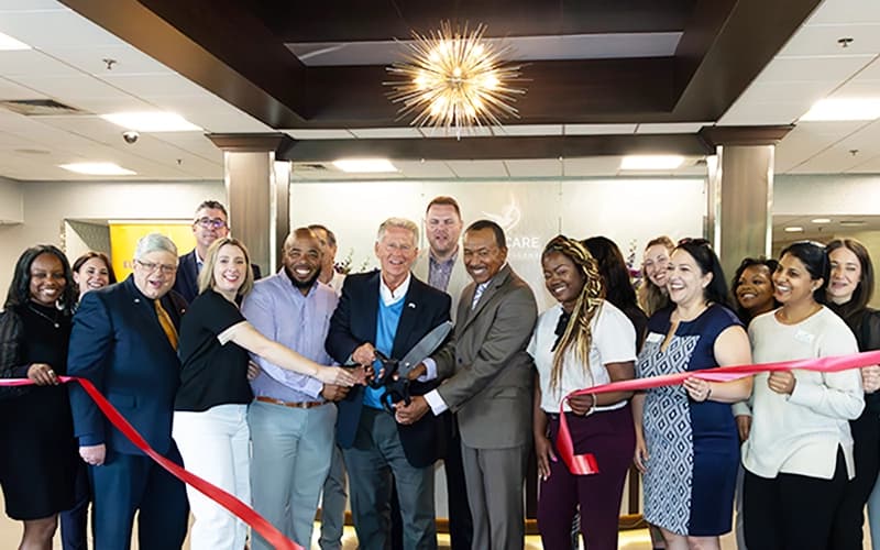 Community members and officials at a ribbon-cutting ceremony